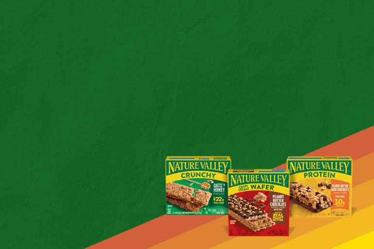 Nature Valley snack bar boxes featuring Crunchy Oats 'n Honey, Crispy Creamy Wafer Peanut Butter Chocolate, and Protein Peanut Butter Dark Chocolate, set against a green background with retro orange, red, and yellow stripes.