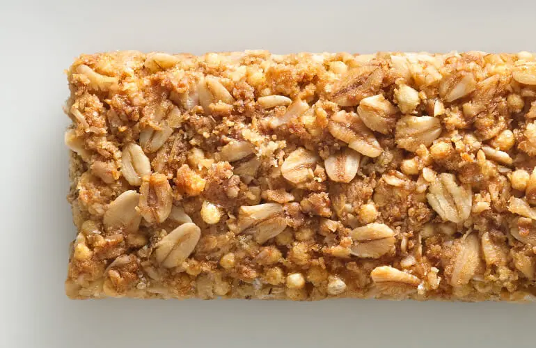 Close-up of an unwrapped Nature Valley crunchy bar.