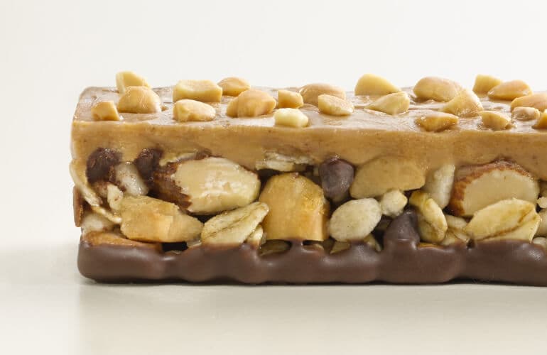 Close-up of unwrapped Nature Valley Peanut Butter Chocolate Three Layer bar.