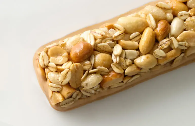 Close up of an unwrapped Nature Valley Sweet & Salty bar.