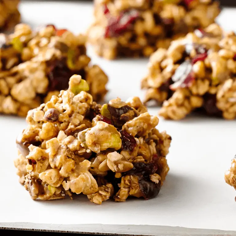 Drops of no-bake cookies made with Nature Valley Oats & Dark Chocolate Protein Granola and cranberries.