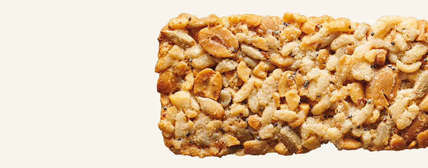 A close-up of a Nature Valley Savory Nut Crunch - Everything Bagel flavor bar.