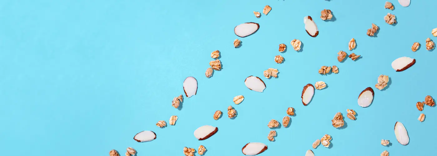 A blue background with scattered nuts