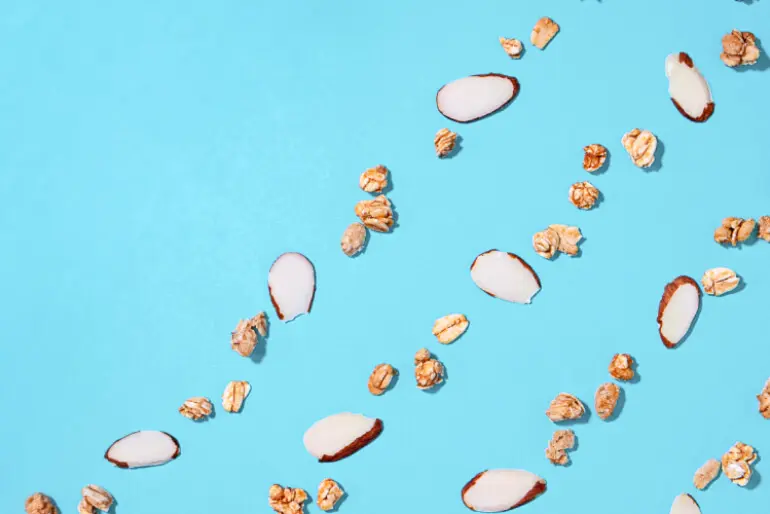 A blue background with scattered nuts.