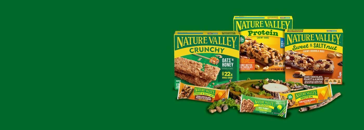 A collection of front facing Nature Valley. products, Crunchy Bars Oats & Honey, Protein Peanut Butter & Chocolate Chewy Bars and Sweet & Salty Dark Chocolate Peanut Almond Chewy Granola Bars on a green background